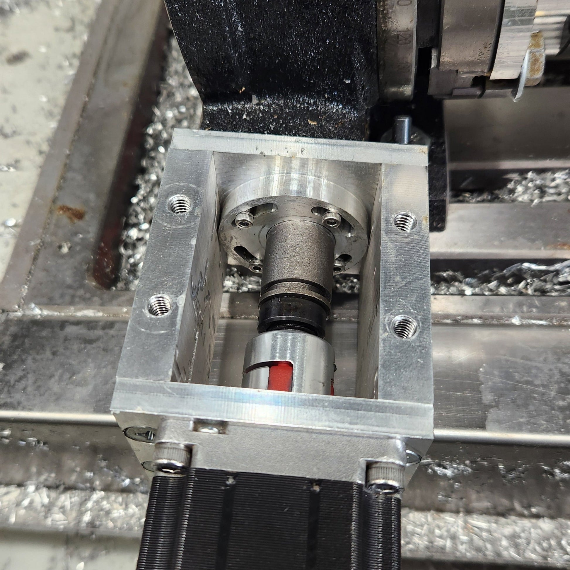 Close-up of 4th axis motor coupler and shaft